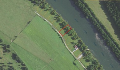 This RV-accessible riverfront lot offers 131 feet of prime - photo 8
