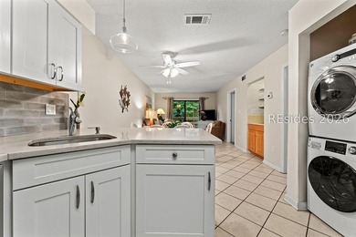 Tucked among mature landscaping in the highly desirable gated - photo 3