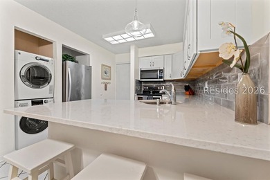 Tucked among mature landscaping in the highly desirable gated - photo 4