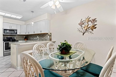 Tucked among mature landscaping in the highly desirable gated - photo 6