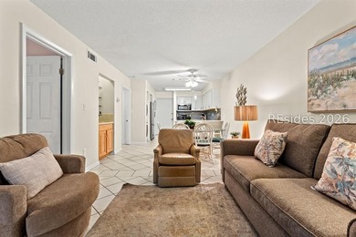 Tucked among mature landscaping in the highly desirable gated - photo 9