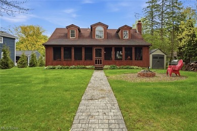 This cozy Lake front home with the warmth & charm of a private - photo 1