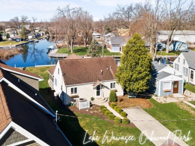Absolutely beautiful move-in ready 1.5 story open concept lake - Lake Home Sale Pending in Syracuse, Indiana