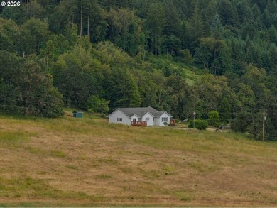 Follow the long private driveway to this secluded 84+ acre farm - photo 1