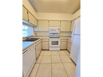 Welcome to this inviting 2-bedroom, 1.5-bath corner unit located - photo 3