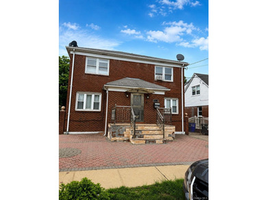 Discover this spacious and versatile two-family brick residence - photo 1