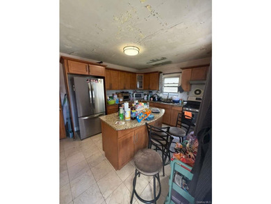 Discover this spacious and versatile two-family brick residence - photo 2