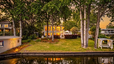 Welcome to 1204 Joyner Drive, a distinctive lakefront residence - photo 3