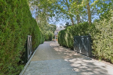 Set on 1.10 private acres backing a protected Georgica Estates - photo 3