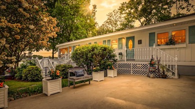 Welcome to 1204 Joyner Drive, a distinctive lakefront residence - photo 5