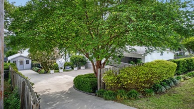 Welcome to 1204 Joyner Drive, a distinctive lakefront residence - photo 7