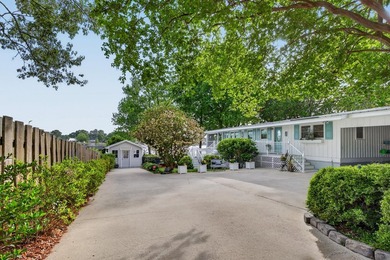 Welcome to 1204 Joyner Drive, a distinctive lakefront residence - photo 8