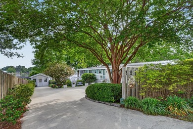 Welcome to 1204 Joyner Drive, a distinctive lakefront residence - photo 9