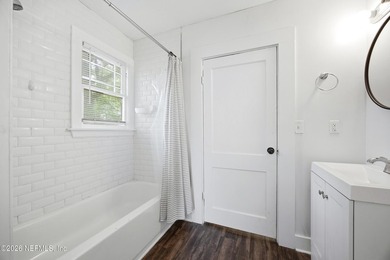 Fully Occupied, beautifully renovated Riverside duplex in an - photo 14
