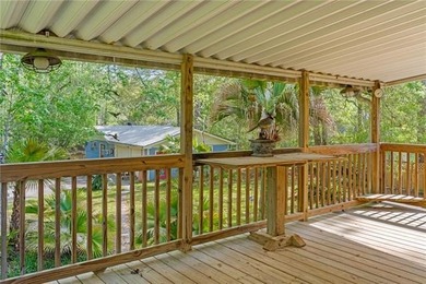 Tucked away on 1.4 private acres along a calm, scenic waterway - photo 24