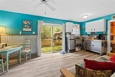 Tucked away on 1.4 private acres along a calm, scenic waterway - photo 32
