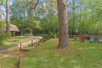 Tucked away on 1.4 private acres along a calm, scenic waterway - photo 38