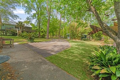 Tucked away on 1.4 private acres along a calm, scenic waterway - photo 39
