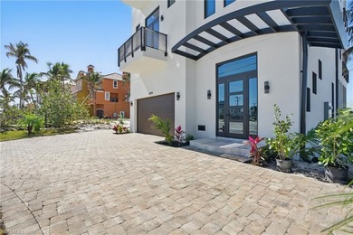 Panoramic Gulf and sand views define this elevated Gulf-front