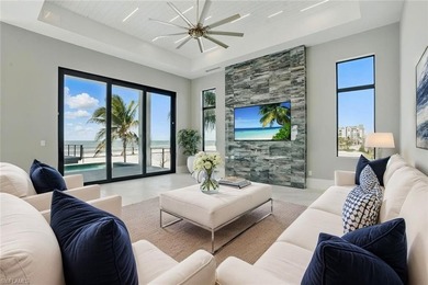 Panoramic Gulf and sand views define this elevated Gulf-front