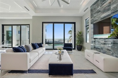 Panoramic Gulf and sand views define this elevated Gulf-front