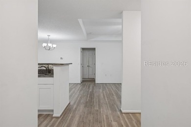 Enjoy wooded views from this second-floor condominium in The - photo 2