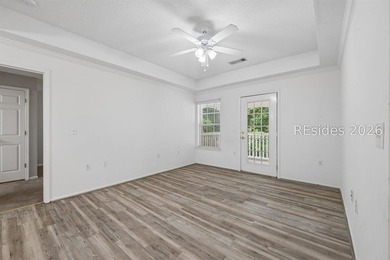 Enjoy wooded views from this second-floor condominium in The - photo 3