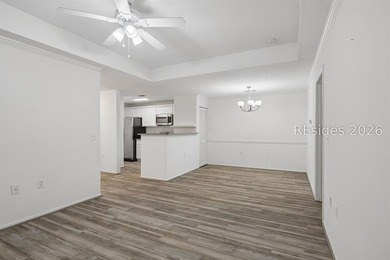Enjoy wooded views from this second-floor condominium in The - photo 5