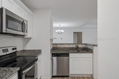 Enjoy wooded views from this second-floor condominium in The - photo 8