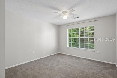 Enjoy wooded views from this second-floor condominium in The - photo 9
