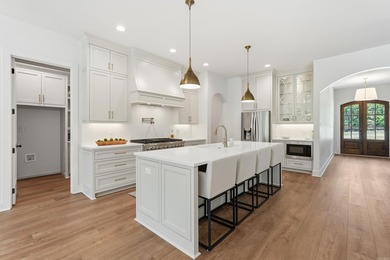 Nestled on a beautifully private homesite in the highly - photo 11
