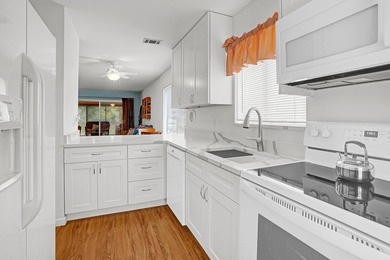 This charming 2 bedroom/2 bath end unit villa is a unique find - photo 13