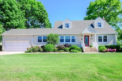 This impeccably maintained expanded Cape Cod offers an abundance - photo 1