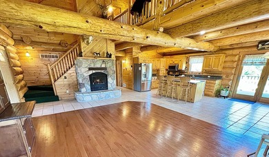 Authentic log cabin retreat on 80 picturesque acres featuring a - photo 5