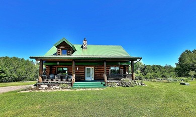 Authentic log cabin retreat on 80 picturesque acres featuring a - photo 8
