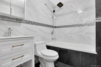 Built in 2021, this legal two-family brick duplex offers a rare - photo 7