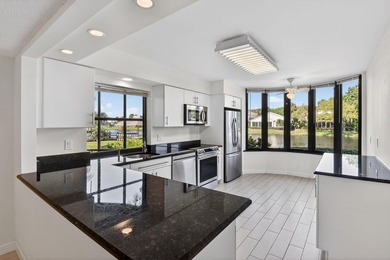 Beautifully maintained 1st floor condominium with extended water - photo 10