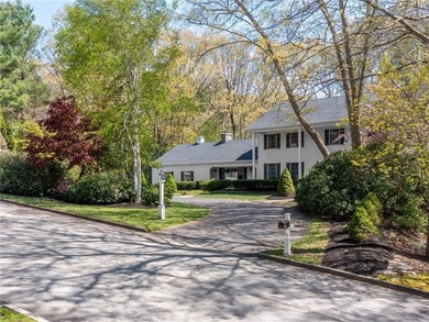 A circular driveway welcomes you to this elegant Colonial set on - photo 2