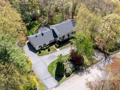 A circular driveway welcomes you to this elegant Colonial set on - photo 3