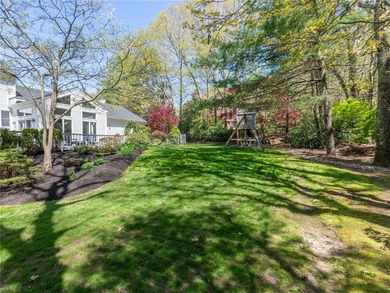 A circular driveway welcomes you to this elegant Colonial set on - photo 5