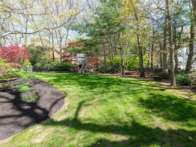A circular driveway welcomes you to this elegant Colonial set on - photo 8