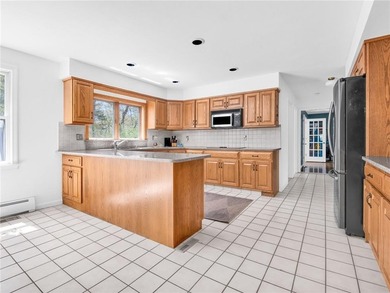 A circular driveway welcomes you to this elegant Colonial set on - photo 10