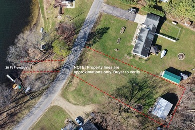 This .4 acre buildable lot includes 30 feet of lake frontage on - photo 2