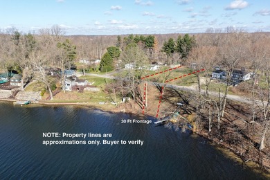 This .4 acre buildable lot includes 30 feet of lake frontage on - photo 4