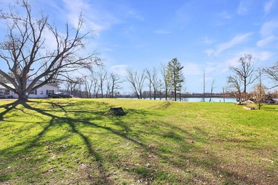 This .4 acre buildable lot includes 30 feet of lake frontage on - photo 8