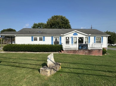 Inviting one-level home situated on a spacious corner lot with a