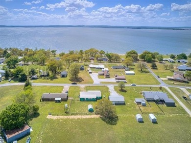Lake life is calling-and this 4 bedroom, 2-bath home answers! - photo 3