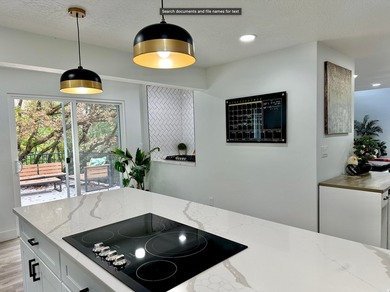This beautifully remodeled home sits hidden, tucked away on a - photo 12
