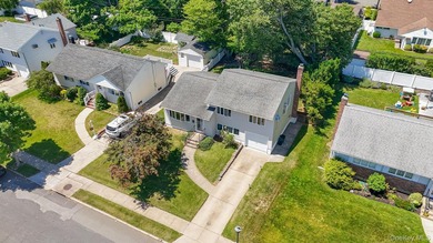 Welcome to this beloved split-level home in the heart of Wantagh - photo 3