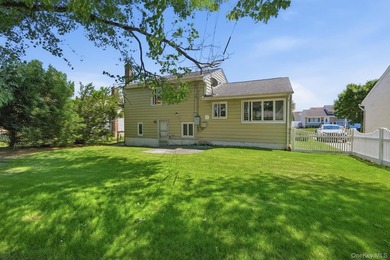 Welcome to this beloved split-level home in the heart of Wantagh - photo 5